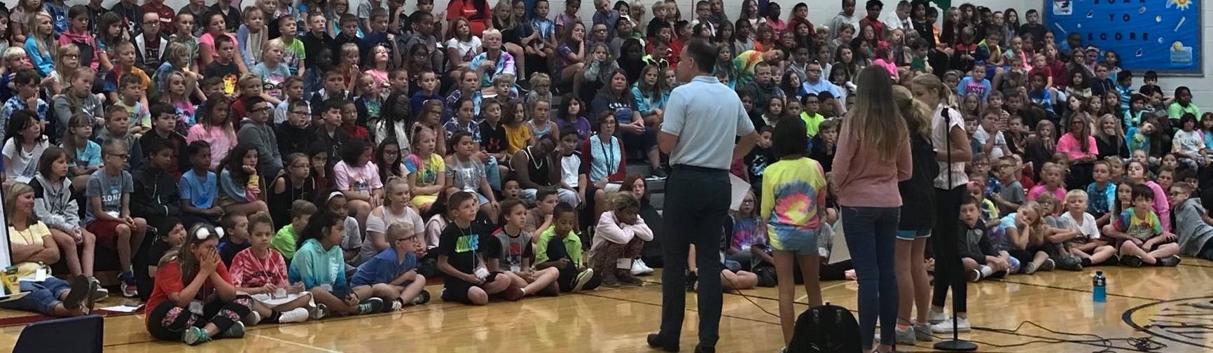 Testimonial page - Joel Katte speaking at a school in front of kids